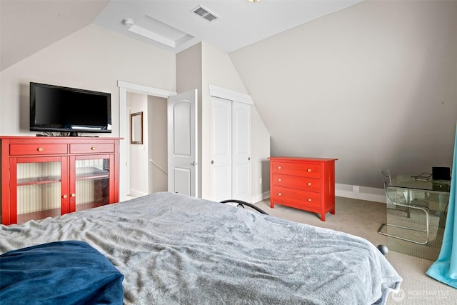 carpeted bedroom featuring baseboards, visible vents, vaulted ceiling, and a closet