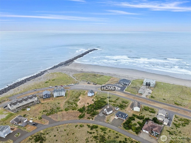aerial view featuring a water view and a view of the beach