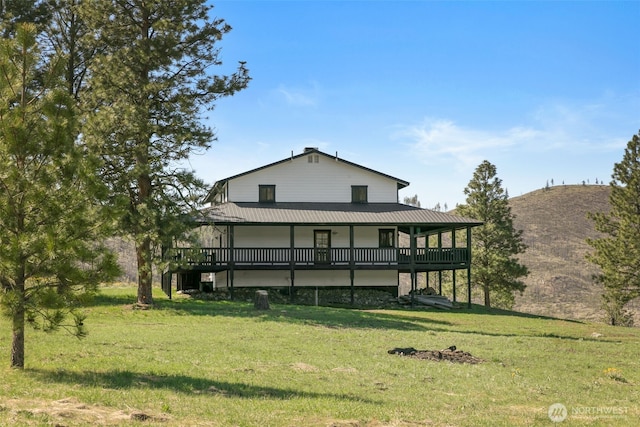 696 Texas Creek Rd, Carlton, WA 98814 - back of property with a lawn and metal roof