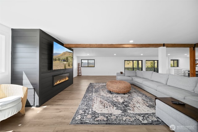696 Texas Creek Rd, Carlton, WA 98814 - living area with recessed lighting, beamed ceiling, a large fireplace, and wood finished floors