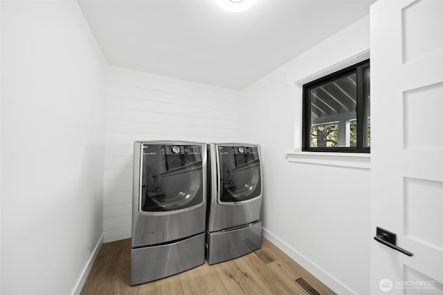 696 Texas Creek Rd, Carlton, WA 98814 - laundry area featuring independent washer and dryer, laundry area, baseboards, and light wood-type flooring