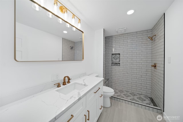 696 Texas Creek Rd, Carlton, WA 98814 - bathroom featuring recessed lighting, vanity, toilet, and tiled shower