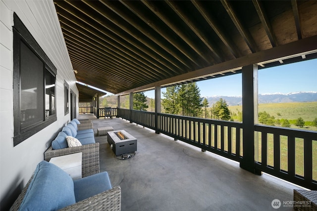 696 Texas Creek Rd, Carlton, WA 98814 - view of patio featuring a mountain view and an outdoor living space with a fire pit