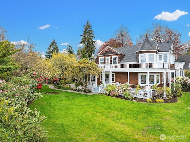 4201 N Mason St, Tacoma, WA 98407 - rear view of property featuring a porch, a balcony, a lawn, a shingled roof, and a chimney