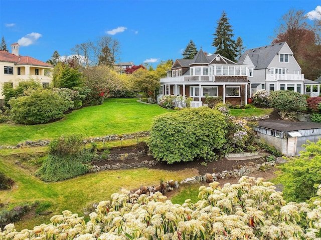 4201 N Mason St, Tacoma, WA 98407 - view of grassy yard featuring a balcony and a wooden deck