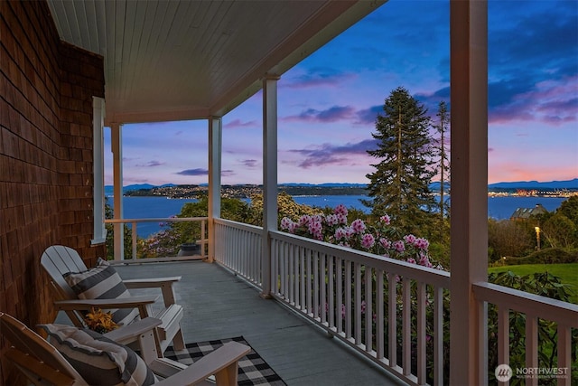 4201 N Mason St, Tacoma, WA 98407 - balcony at dusk featuring a water view