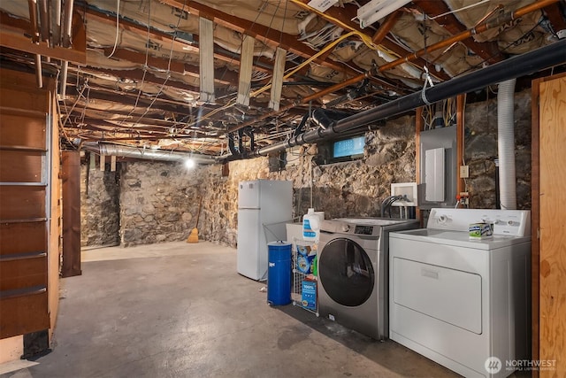 4201 N Mason St, Tacoma, WA 98407 - unfinished basement with freestanding refrigerator, electric panel, and washing machine and clothes dryer