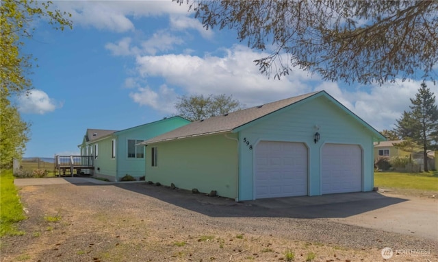 view of side of property featuring a deck