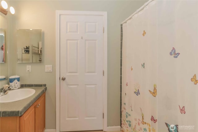 full bath featuring vanity and a shower with curtain