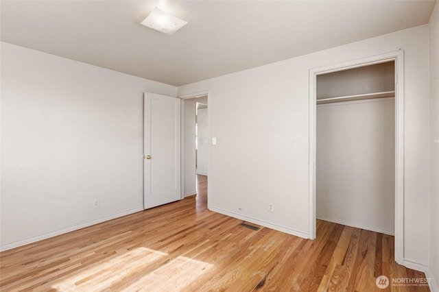 129 G St SE, Ephrata, WA 98823 - unfurnished bedroom with light wood-style flooring, a closet, and baseboards