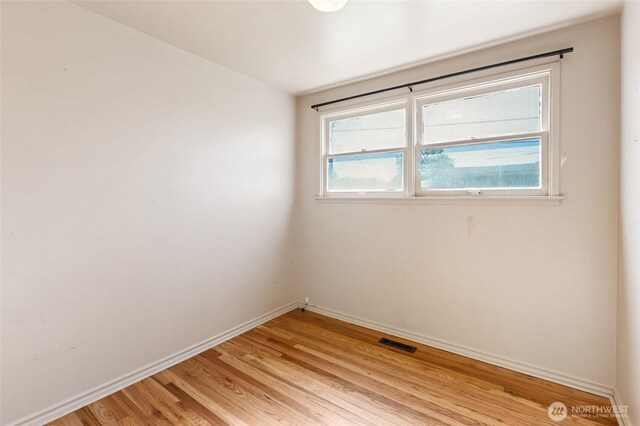 129 G St SE, Ephrata, WA 98823 - spare room with baseboards and light wood finished floors