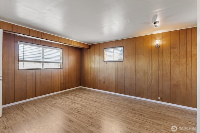 129 G St SE, Ephrata, WA 98823 - spare room featuring wood finished floors, baseboards, and wooden walls
