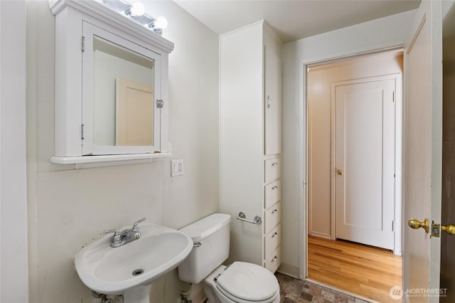129 G St SE, Ephrata, WA 98823 - half bath with a sink, toilet, and stone finish floors