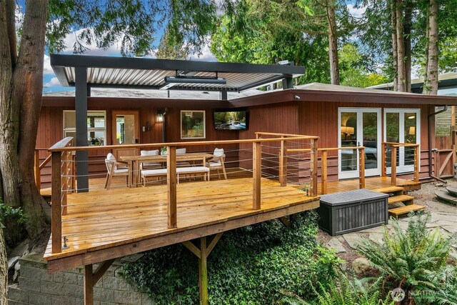 rear view of house with a wooden deck