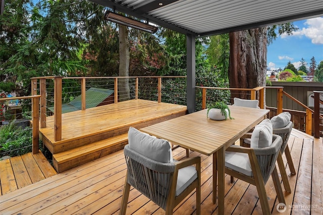 wooden terrace featuring outdoor dining space