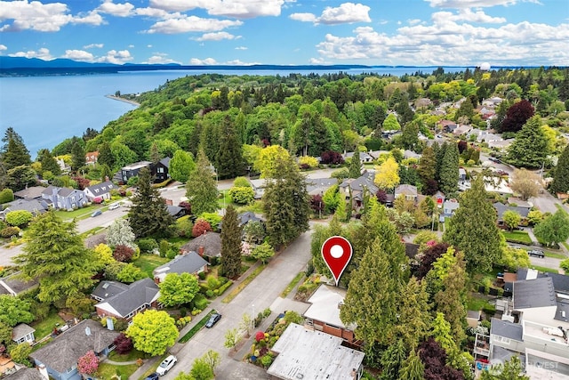 aerial view of residential area with a nearby body of water