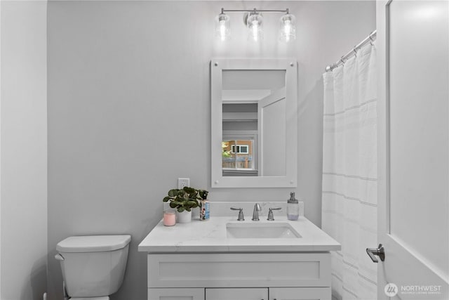 full bathroom featuring toilet and vanity