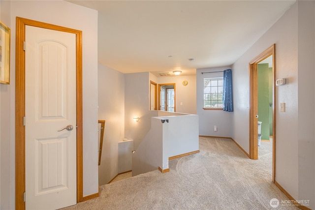 1006 Cathleen St, Port Angeles, WA 98363 - hallway featuring light colored carpet, an upstairs landing, and baseboards