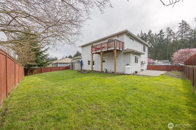 1006 Cathleen St, Port Angeles, WA 98363 - back of house with an outdoor fire pit, a fenced backyard, a patio, and a lawn