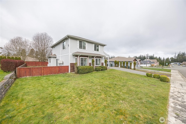 1006 Cathleen St, Port Angeles, WA 98363 - traditional-style home with concrete driveway, fence, and a front lawn