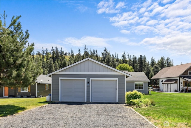 1140 Twin Lakes Rd, Cle Elum, WA 98922 - ranch-style house featuring a front lawn, board and batten siding, an outdoor structure, and driveway