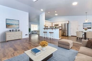 36850 12th Ave S, Federal Way, WA 98003 - living room with lofted ceiling, wood finished floors, and recessed lighting
