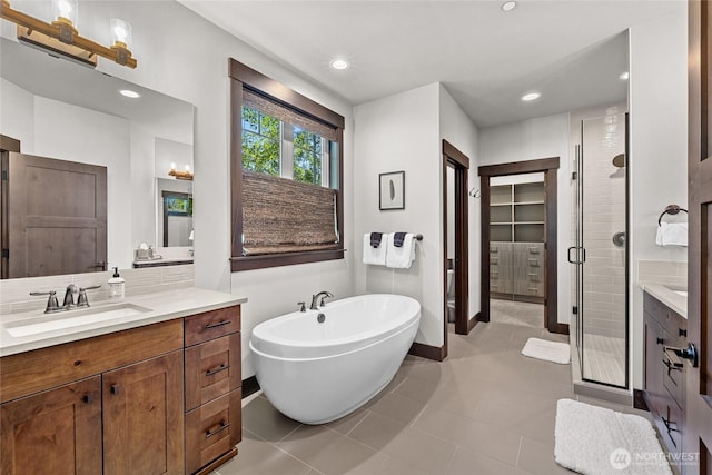 31 Powder Cap Ct, Cle Elum, WA 98922 - full bathroom with vanity, a stall shower, tile patterned flooring, recessed lighting, and a freestanding bath
