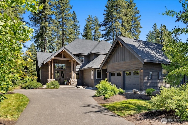 31 Powder Cap Ct, Cle Elum, WA 98922 - view of front of property with a garage, aphalt driveway, board and batten siding, and a shingled roof