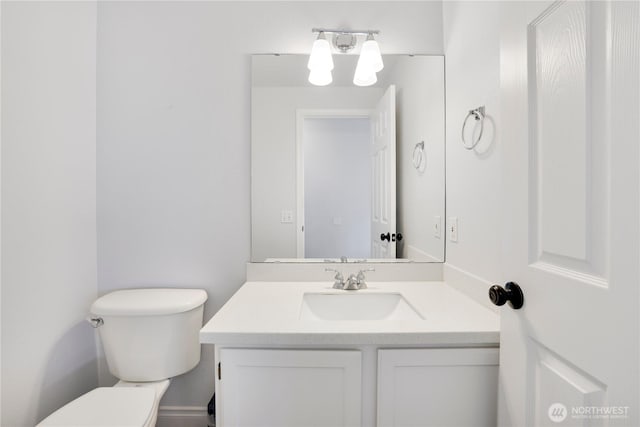 half bath with toilet and vanity