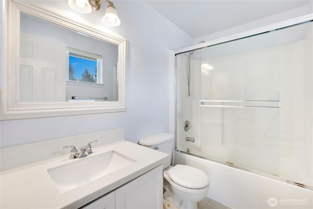 full bath with toilet, vanity, and combined bath / shower with glass door