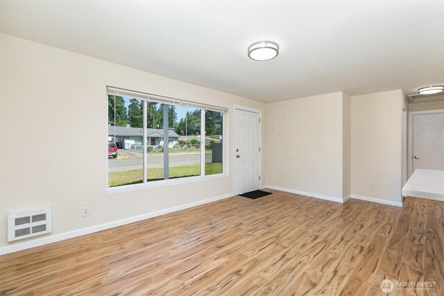 3513 NE 7th Pl, Renton, WA 98056 - unfurnished room featuring light wood-style flooring and baseboards