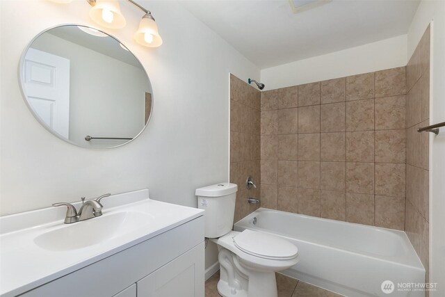 3513 NE 7th Pl, Renton, WA 98056 - bathroom featuring tile patterned flooring, toilet, vanity, and tub / shower combination