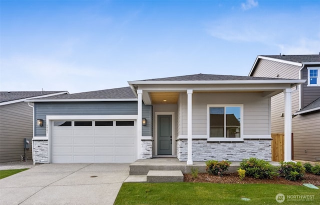 5941 Thornhill Ave SW Unit 291, Port Orchard, WA 98367 - view of front of home with a garage, driveway, and stone siding