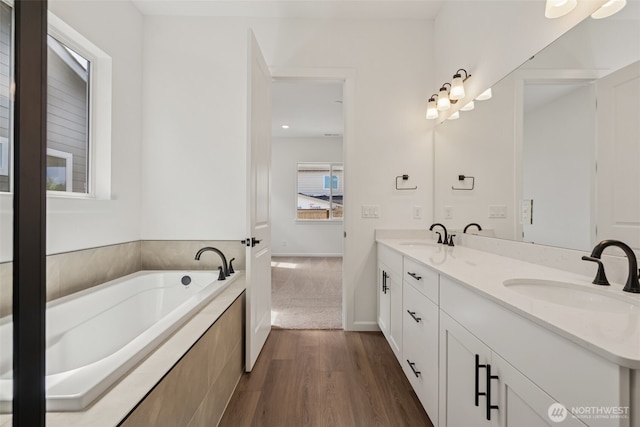 5941 Thornhill Ave SW Unit 291, Port Orchard, WA 98367 - bathroom featuring double vanity, wood finished floors, and a bath