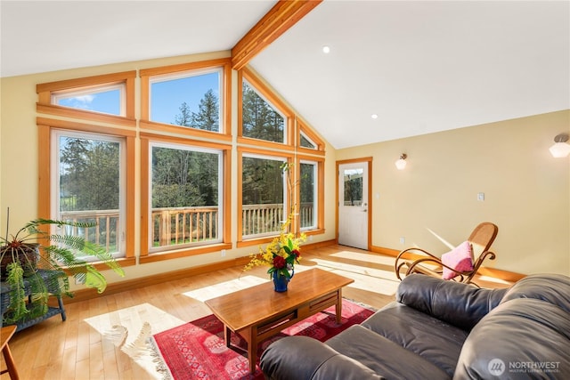 324 Gill Ln, Friday Harbor, WA 98250 - living area with beamed ceiling, baseboards, high vaulted ceiling, and wood-type flooring
