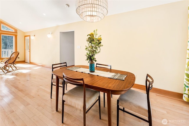324 Gill Ln, Friday Harbor, WA 98250 - dining space featuring light wood-style flooring, a chandelier, baseboards, and lofted ceiling