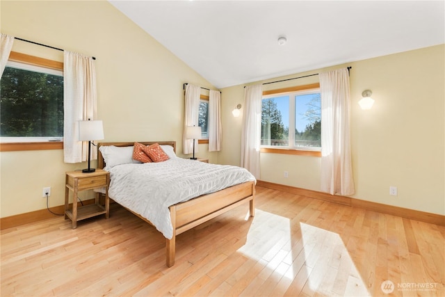 324 Gill Ln, Friday Harbor, WA 98250 - bedroom featuring light wood-type flooring, baseboards, and vaulted ceiling