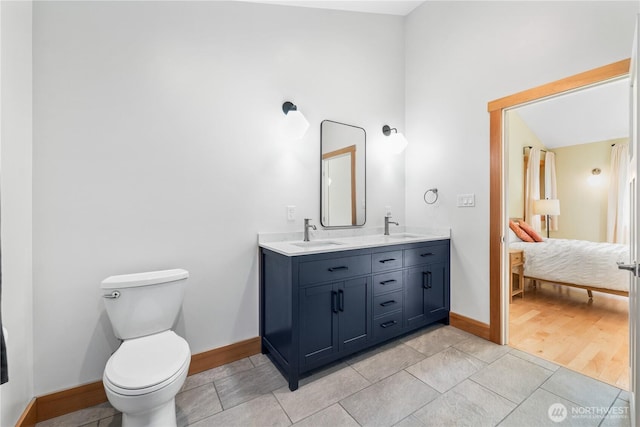 324 Gill Ln, Friday Harbor, WA 98250 - ensuite bathroom with toilet, a sink, baseboards, and connected bathroom