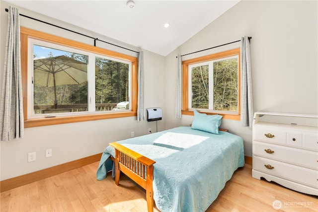 324 Gill Ln, Friday Harbor, WA 98250 - bedroom with light wood-type flooring, baseboards, lofted ceiling, and recessed lighting