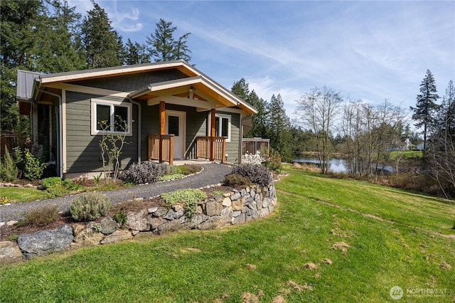 324 Gill Ln, Friday Harbor, WA 98250 - bungalow featuring a front yard, a porch, and a water view