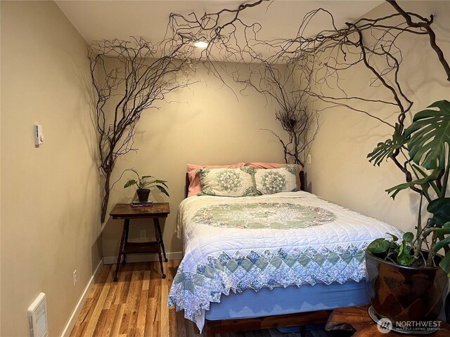 324 Gill Ln, Friday Harbor, WA 98250 - bedroom featuring visible vents, baseboards, and wood finished floors