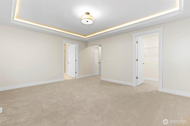 19457 116th St E, Bonney Lake, WA 98391 - unfurnished room with a raised ceiling, light carpet, and baseboards