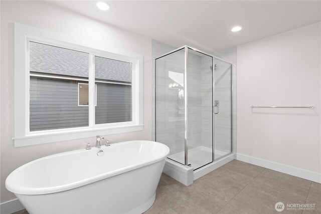 19457 116th St E, Bonney Lake, WA 98391 - full bath featuring a freestanding bath, a shower stall, baseboards, tile patterned floors, and recessed lighting
