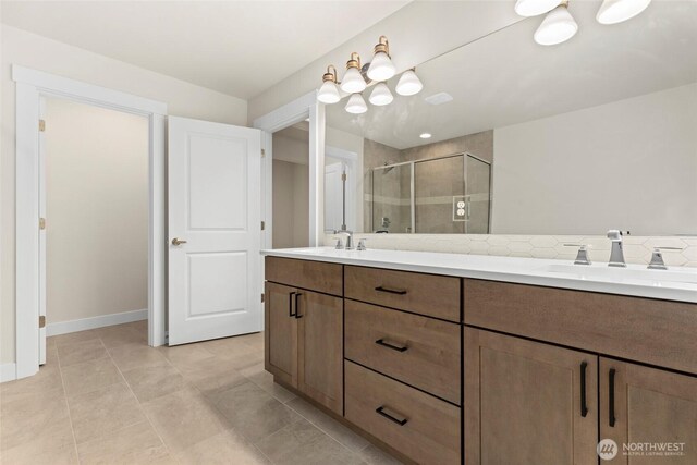 19457 116th St E, Bonney Lake, WA 98391 - full bath with double vanity, a stall shower, tasteful backsplash, and tile patterned floors
