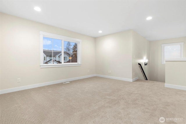 19457 116th St E, Bonney Lake, WA 98391 - spare room featuring light carpet, recessed lighting, and baseboards