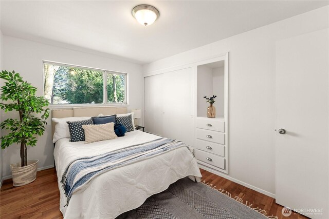 14207 6th Ave S, Burien, WA 98168 - bedroom with a closet, baseboards, and wood finished floors