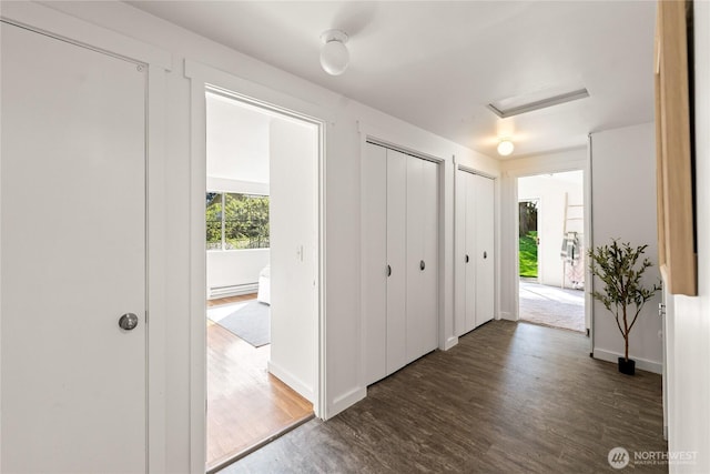 14207 6th Ave S, Burien, WA 98168 - entryway featuring a baseboard radiator, baseboards, and wood finished floors
