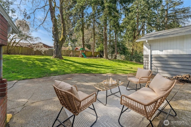 14207 6th Ave S, Burien, WA 98168 - view of patio / terrace with an outdoor living space, a fenced backyard, and a playground
