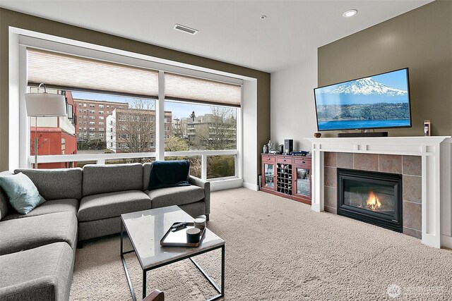 708 Market St Unit 711, Tacoma, WA 98402 - living room featuring carpet floors, a tile fireplace, baseboards, visible vents, and recessed lighting