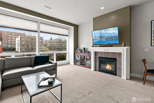 708 Market St Unit 711, Tacoma, WA 98402 - carpeted living area featuring baseboards, visible vents, recessed lighting, and a tile fireplace